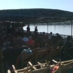 a group of people sitting on a boat