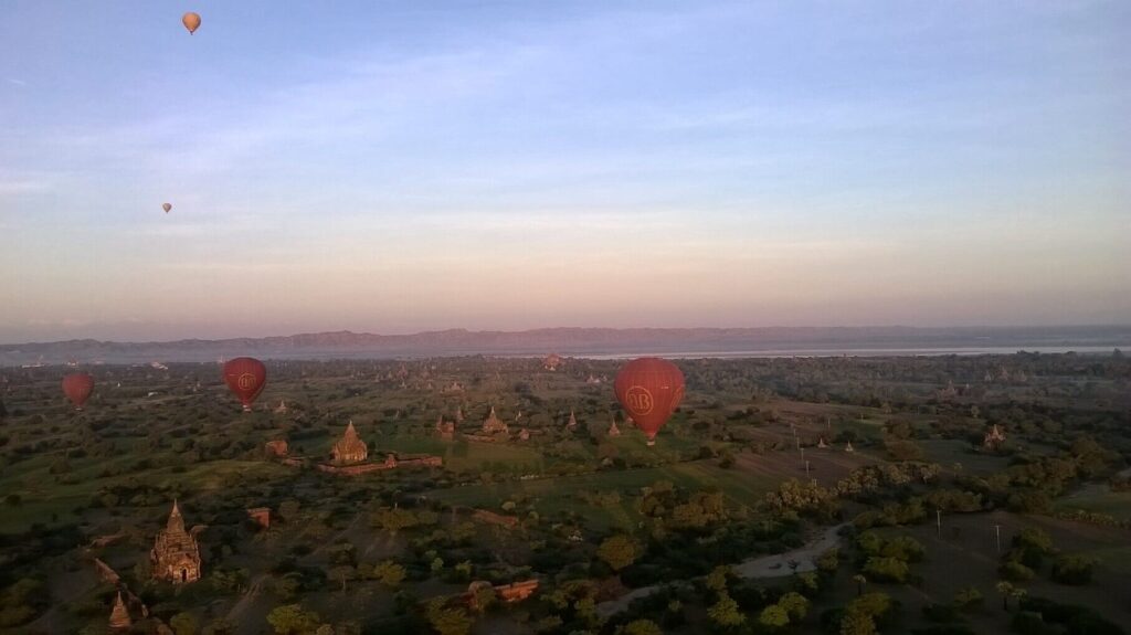 hot air balloons over a landscape