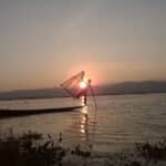 a man holding a net in the water